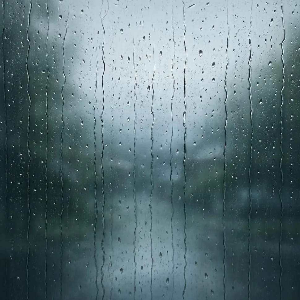 A rainy window evoking soft rain sounds