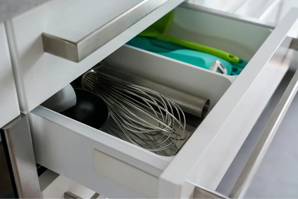 A perfectly organized junk drawer with dividers