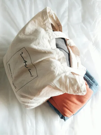 Illustration of a reusable tote bag on a bed