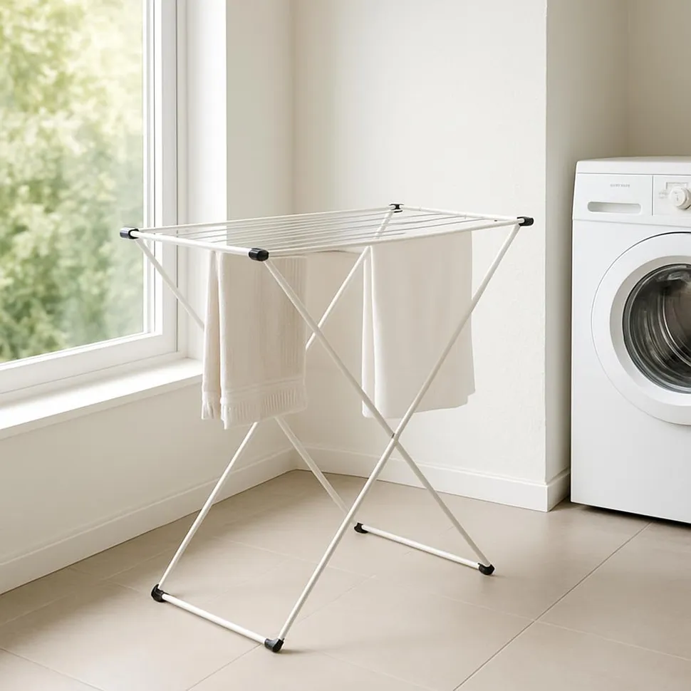 Slim foldable drying rack in a bright laundry nook