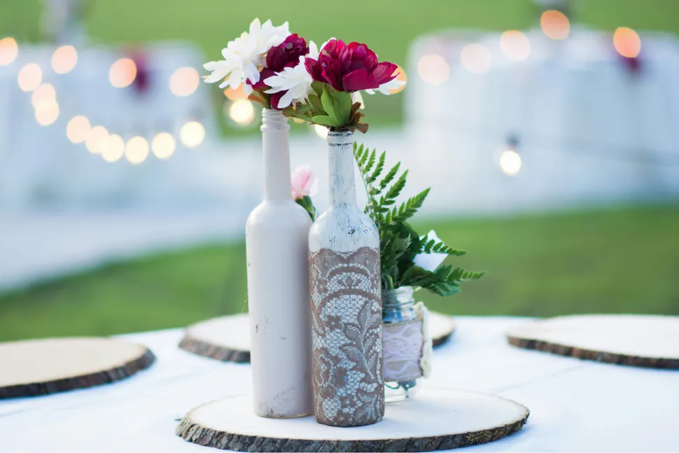 Wine bottle vase with fresh flowers