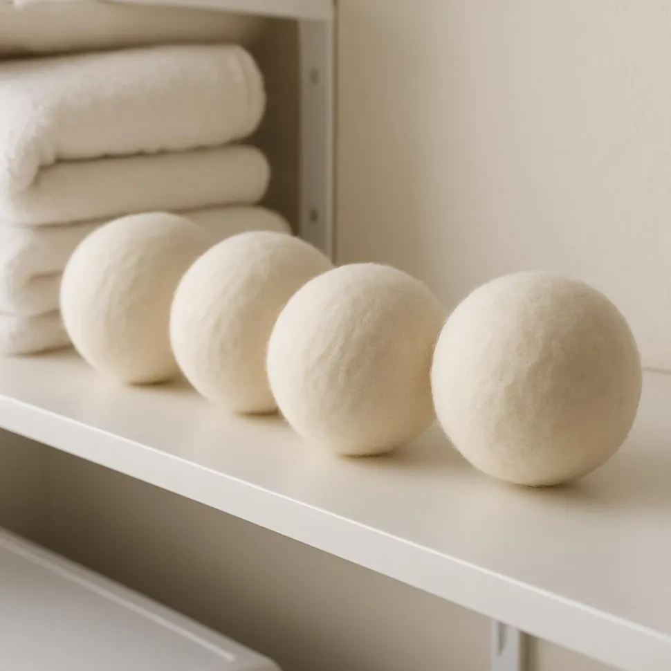 Wool dryer balls on a laundry shelf